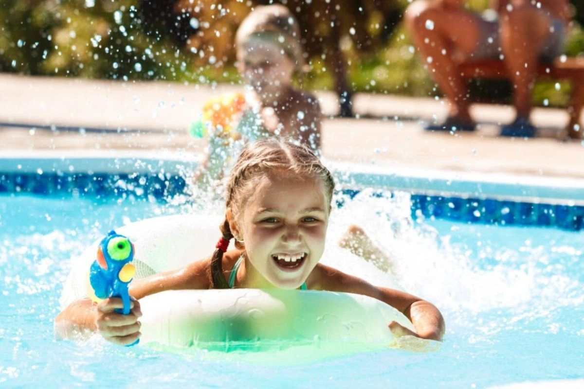 Kids having a great time playing in the pool