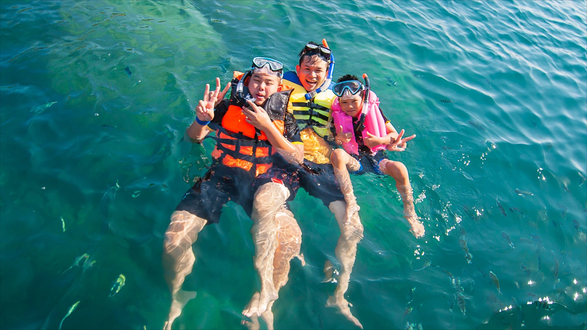 Family snorkeling in the Mesoamerican Reef