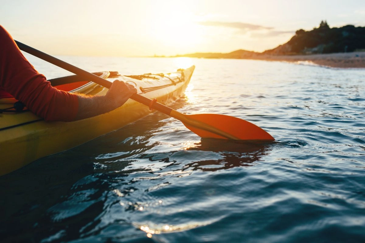 Kayaking in the ocean enjoying the sunset