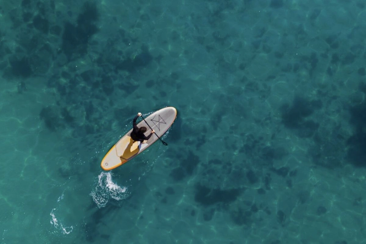 Paddle boarding in the caribbean ocean