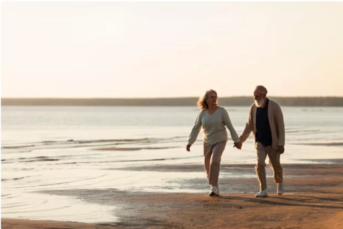 Couple taking a long stroll on the beach