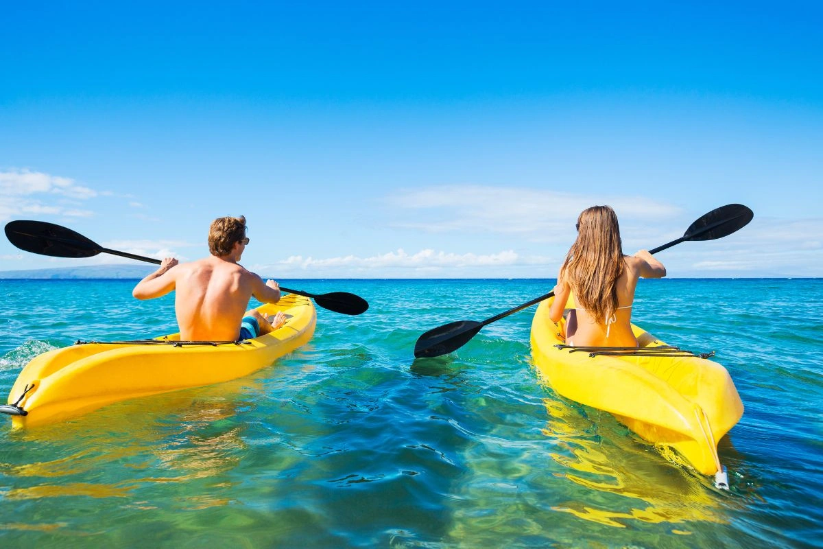 Couple kayaking in the beautiful caribbean ocean