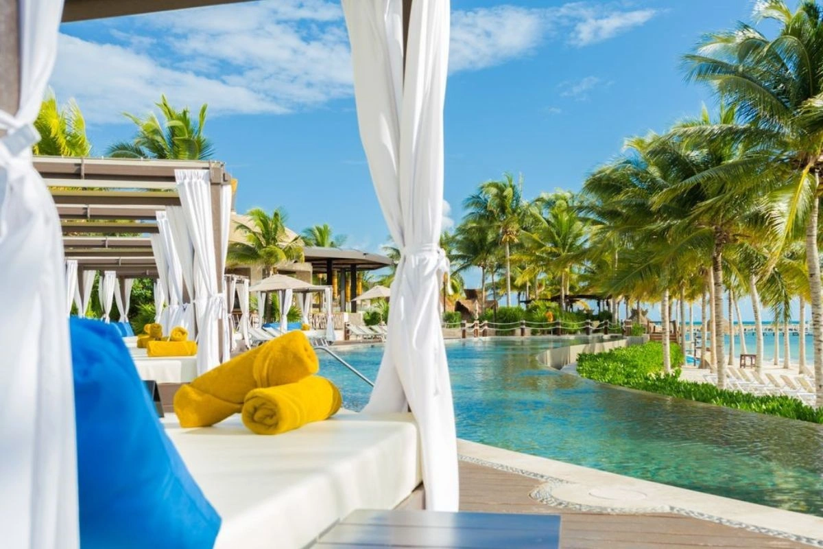 Resting in a beautiful private cabana in front of the pool