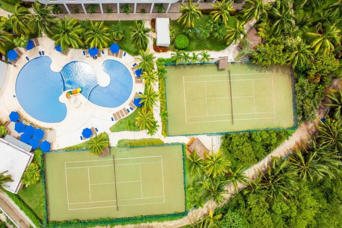 pools and tennis court view of palmar beach resort