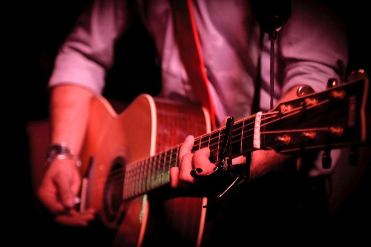 Playing guitar in a live music night