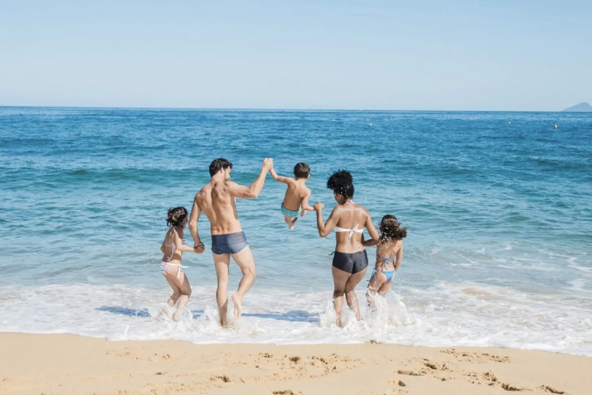 Family having fun on the bech