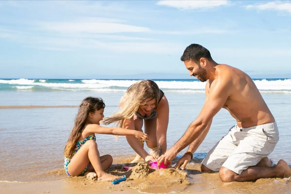Family having fun in the beach